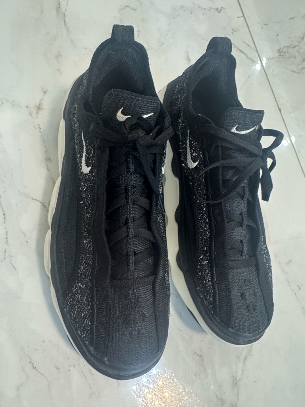 Nike Black Sneakers with White Swoosh Accents